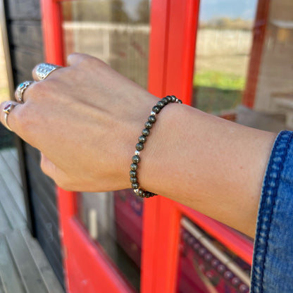 PULSERA ELASTICADA "Acción y prosperidad" | Pirita | Plata 925